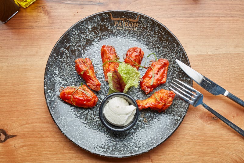 Classic Buffalo wings with hot sauce